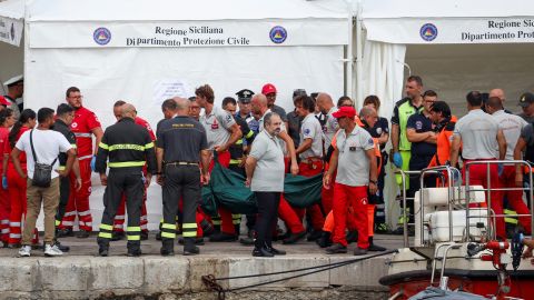 Rescue personnel transport a body after a luxury yacht, which was carrying British entrepreneur Mike Lynch, sank off the coast of Porticello, near the Sicilian city of Palermo, Italy, August 21, 2024. REUTERS/Louiza Vradi