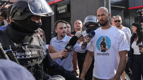 Romanian Gendarmes from the Special Intervention Brigade escort Andrew Tate outside the Tate brothers residence in Pipera, Ilfov, near Bucharest, Romania, August 21, 2024. Inquam Photos/Octav Ganea via REUTERS ATTENTION EDITORS - THIS IMAGE WAS PROVIDED BY A THIRD PARTY. ROMANIA OUT. NO COMMERCIAL OR EDITORIAL SALES IN ROMANIA