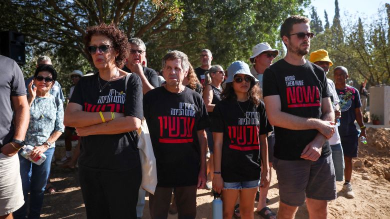 Mourners attend the funeral of Yagev Buchshtab, one of the six hostages whose bodies were retrieved from Gazan captivity and brought to Israel in a military operation, in Kibbutz Nirim, southern Israel, August 21, 2024. REUTERS/Florion Goga