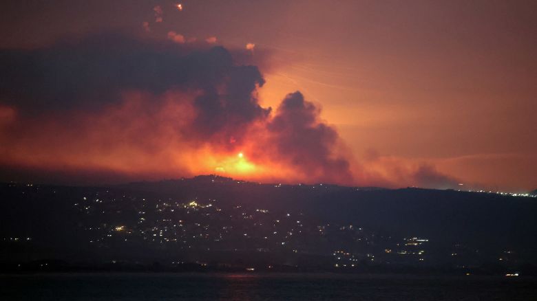 A view shows smoke and fire on the Lebanese side of the border with Israel, after Israel said it carried out strikes on Hezbollah targets in Lebanon, as seen from Tyre, southern Lebanon, on August 25, 2024.