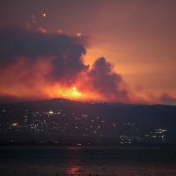 A view shows smoke and fire on the Lebanese side of the border with Israel, after Israel said it carried out strikes on Hezbollah targets in Lebanon, as seen from Tyre, southern Lebanon, on August 25, 2024.