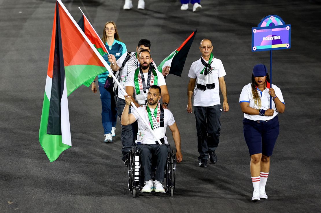 Paris 2024 Paralympics - Opening Ceremony - Paris, France - August 28, 2024 Fadi J S Aldeeb of Palestine leads their contingent during the opening ceremony REUTERS/Umit Bektas