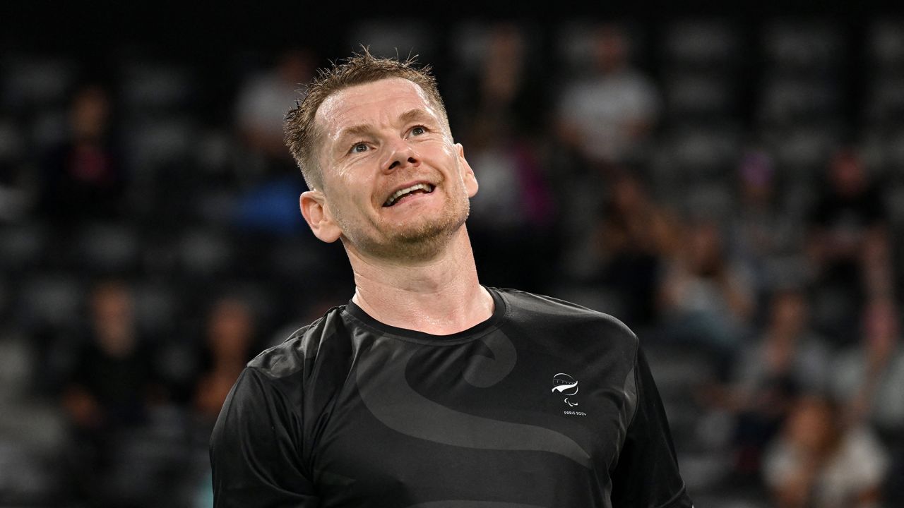 Paris 2024 Paralympics - Badminton - Men's Singles SL3 Group Play Stage - Group B Match - Porte de La Chapelle Arena, Paris, France - August 30, 2024 Wojtek Czyz of New Zealand reacts during his match against Oleksandr Chyrkov of Ukraine.