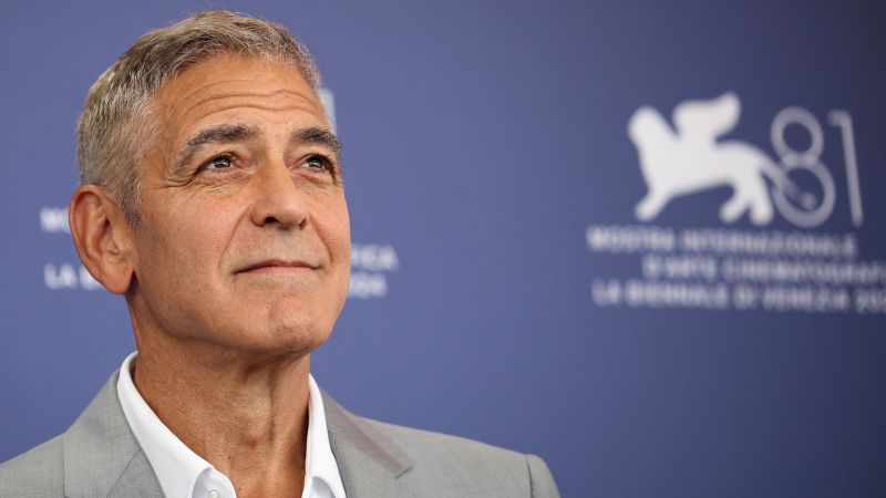 
                            George Clooney is farming and driving a tractor. Seriously