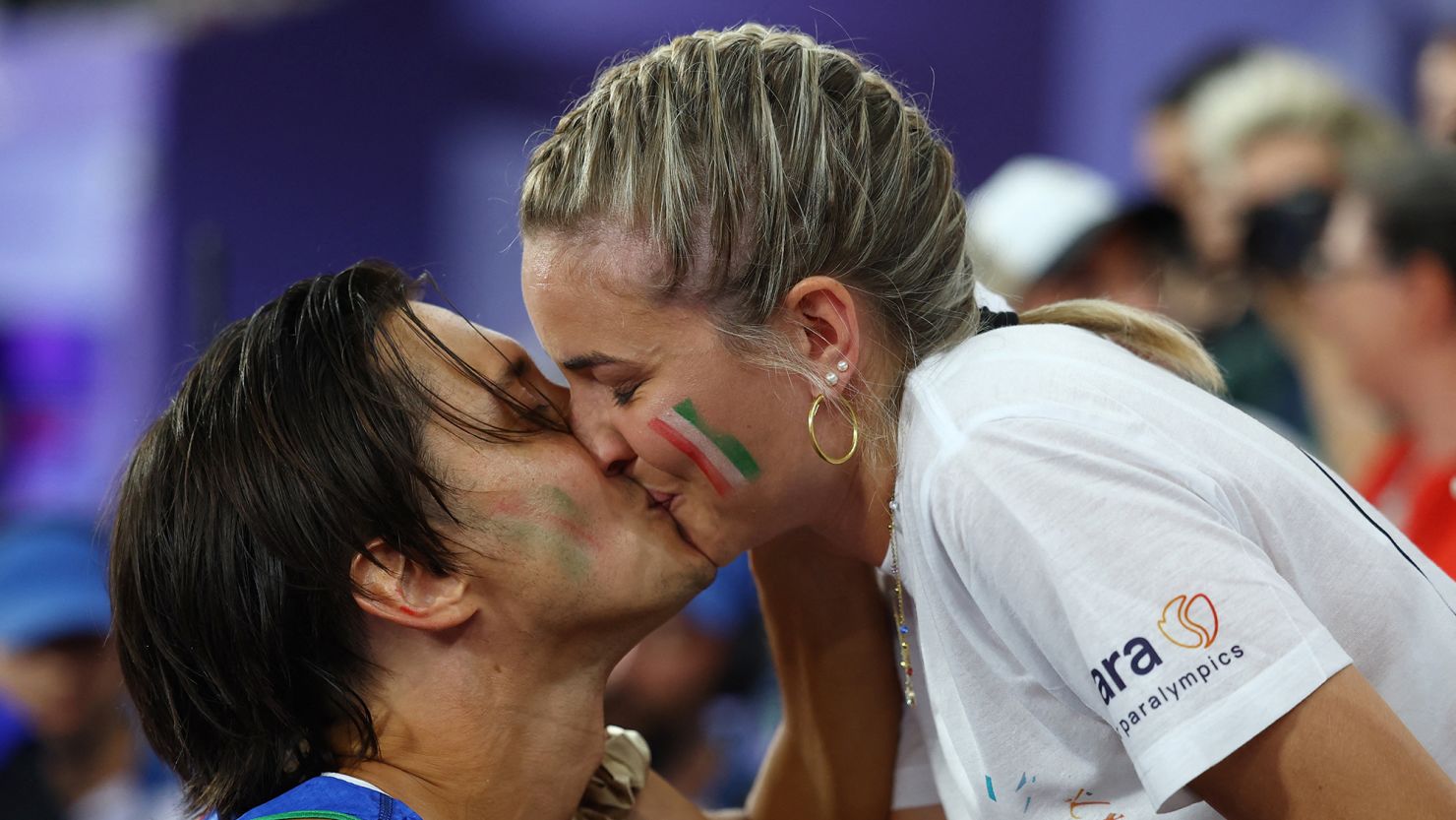 Alessandro Ossola's surprised girlfriend Ariana accepted his proposal at the Stade de France.