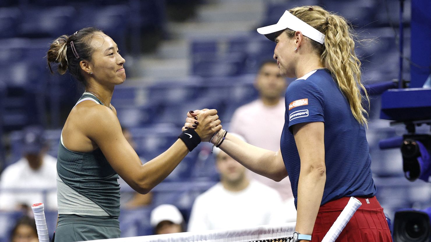 Zheng Qinwen shakes hands with Donna Vekić after the latest finish ever at a women's match at the US Open.