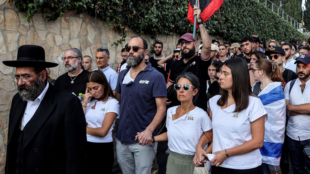 Jonathan Polin and Rachel Goldberg, parents of killed US-Israeli hostage Hersh Goldberg-Polin whose body was recovered with five other hostages in Gaza, attend the funeral in Jerusalem on September 2, 2024, amid the ongoing conflict between Israel and the Palestinian militant group Hamas.