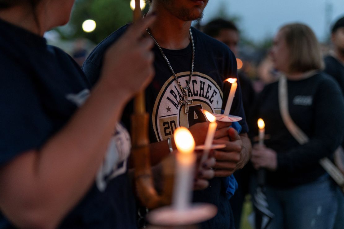 People hold candles during a vigil following the shooting at Apalachee High School, at Jug Tavern Park in Winder, Georgia, on September 6.