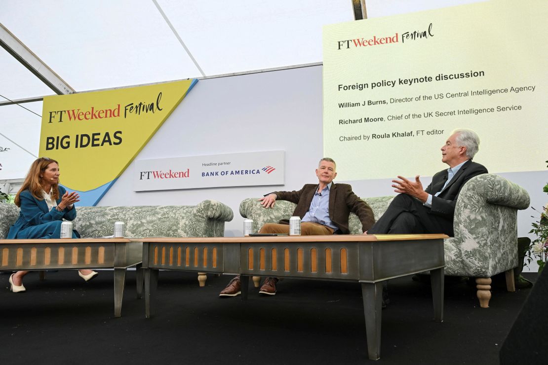 MI6 chief Richard Moore, center, and CIA director Bill Burns, right, are interviewed by Roula Khalaf, editor of the Financial Times, on Saturday.