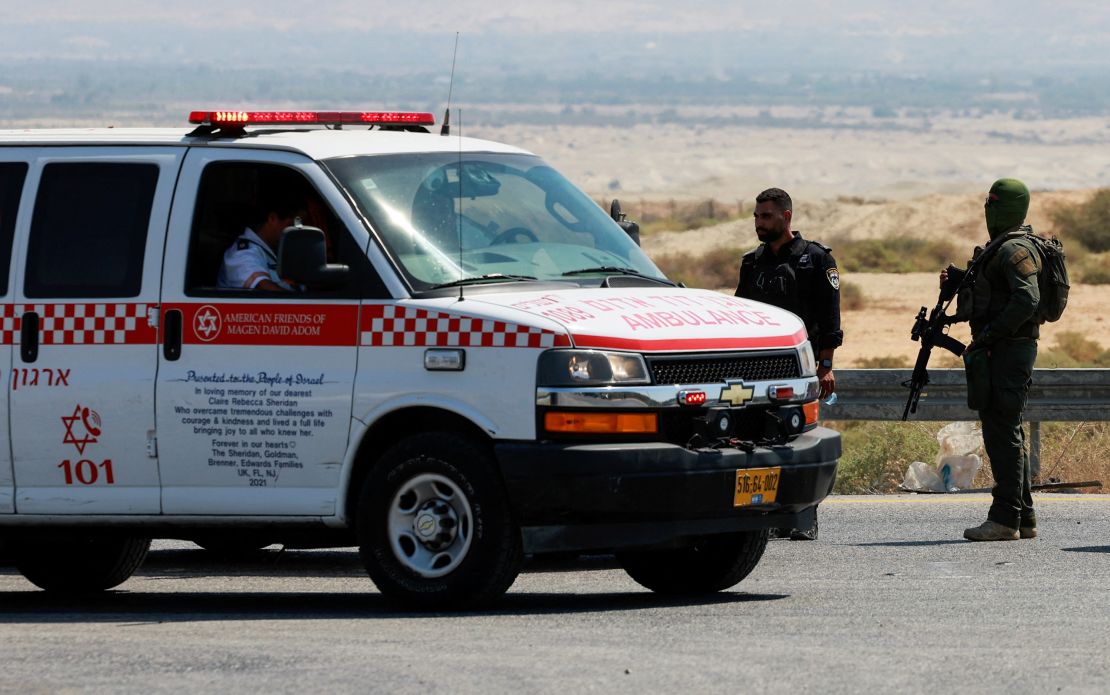 An Israeli policeman and soldier patrol the area near the crossing.