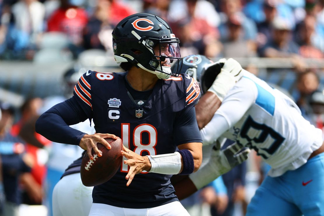 September 8, 2024; Chicago, Illinois, USA; Chicago Bears quarterback Caleb Williams (18) drops back to pass during the second half against the Tennessee Titans at Soldier Field. Mandatory Photo Credit: Mike Dinovo-Imagn Images