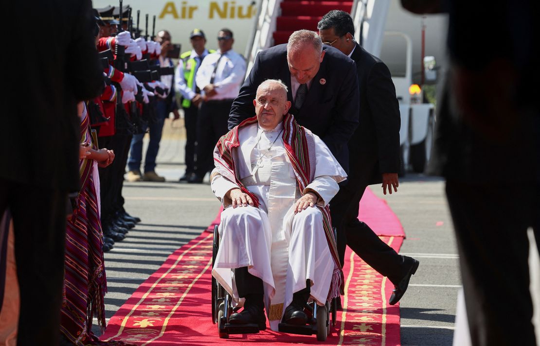 Pope Francis wears a scarf he was presented with when he arrived in Dili, East Timor, September 9, 2024.