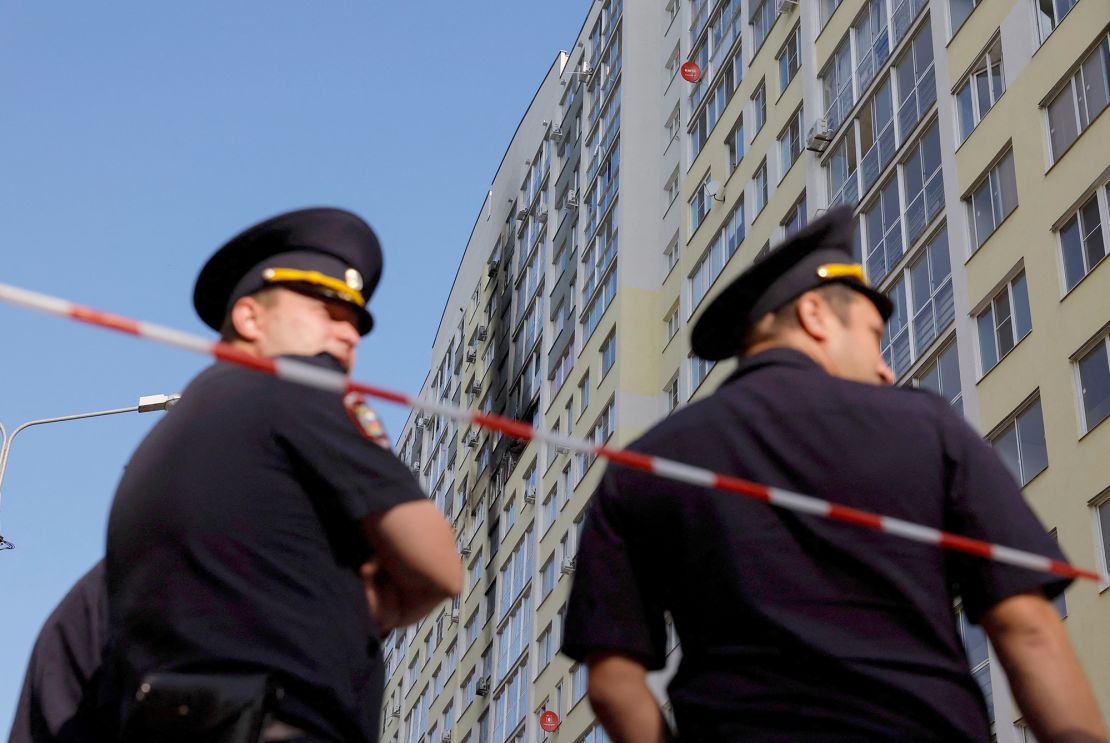 Russian police stand guard after the drone attack.