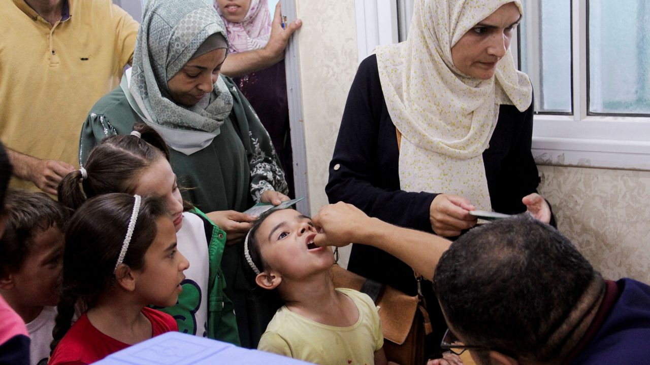 A Palestinian child is vaccinated against polio in Jabalya, northern Gaza, on September 10.