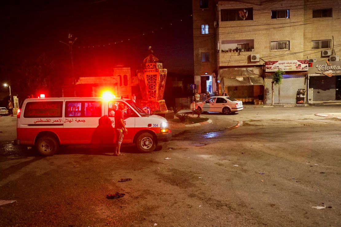 An ambulance is seen at the site of Israeli strikes where Palestinians were killed, in Tubas in the occupied West Bank, on September 11, 2024.