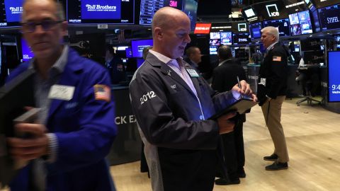 Traders work on the floor at the New York Stock Exchange on September 11.