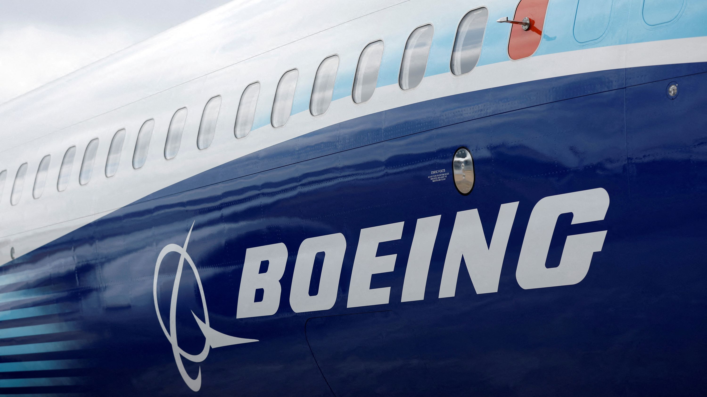 The Boeing logo is seen on the side of a Boeing 737 MAX at the Farnborough International Airshow, in Farnborough, Britain, July 20, 2022.