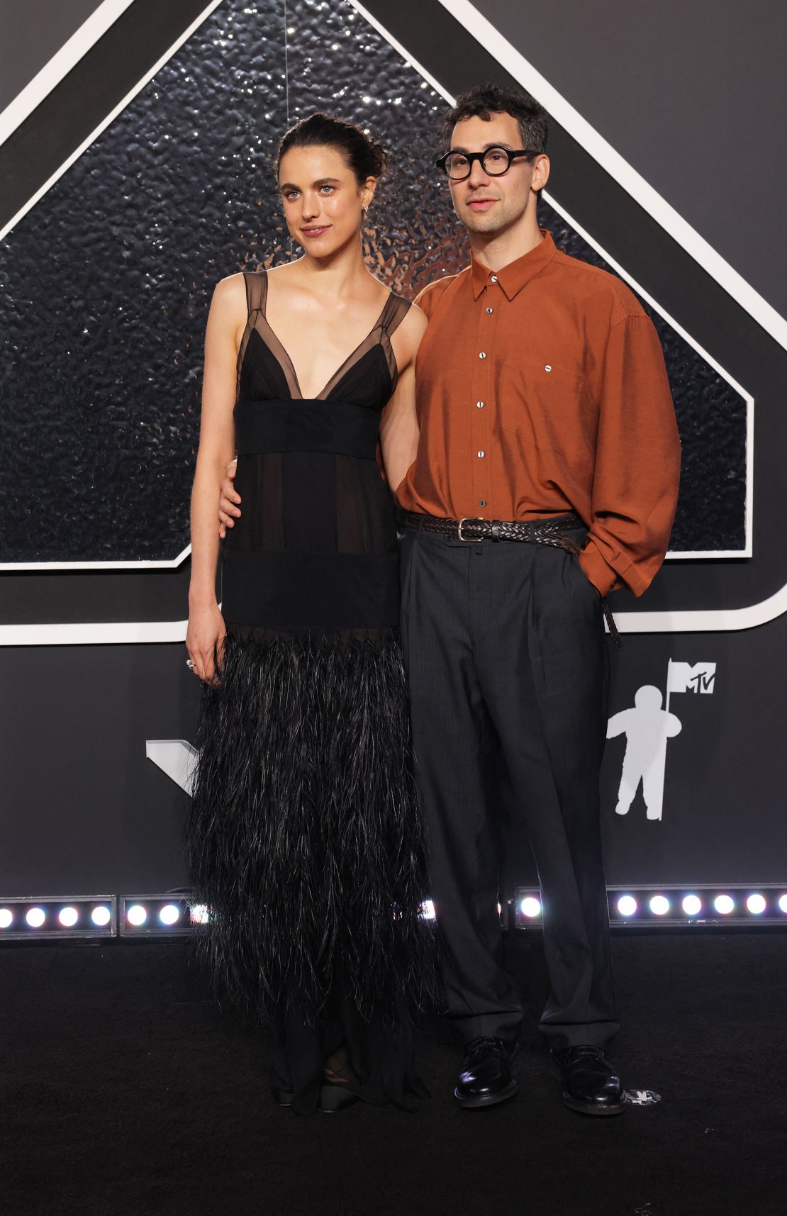 Margaret Qualley, posing with husband Jack Antonoff, wore a feathery black chiffon Chanel dress modeled on a look from the label’s Haute Couture Fall-Winter 1995/96 collection.