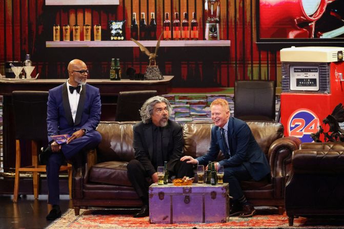 From left, Damon Wayans, George Lopez and Jesse Tyler Ferguson hang out in an on-stage "man cave" before presenting the Emmy for lead actor in a comedy series. They used the opportunity to <a href="https://www.cnn.com/entertainment/live-news/emmy-awards-levy-09-15-24#h_86dde5eb9308d058d76930fbe6aa3db9">thank their TV spouses</a>.