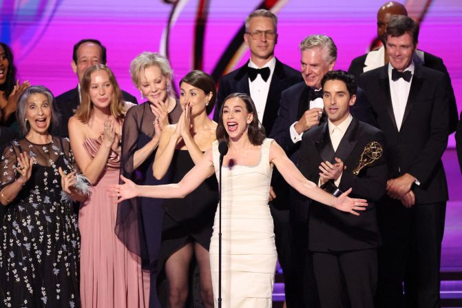 The cast and crew of "Hacks" accept the Emmy for outstanding comedy series.