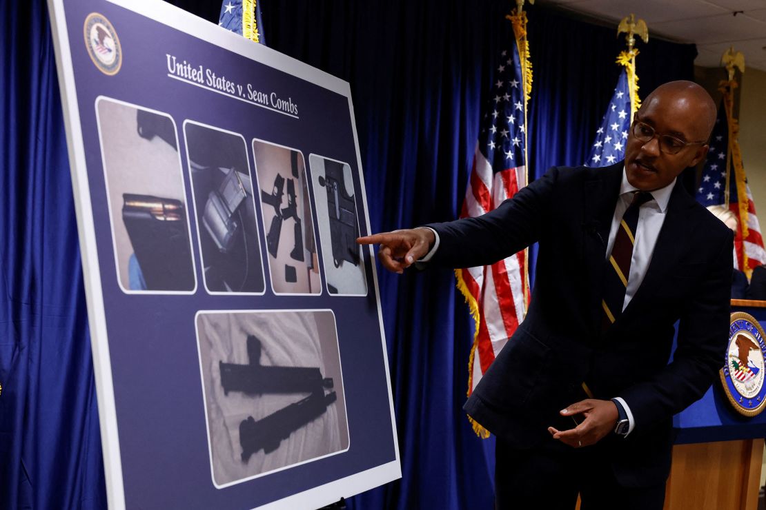 U.S. Attorney Damian Williams on Tuesday pointed to a chart showing the firearms seized during Sean's search 