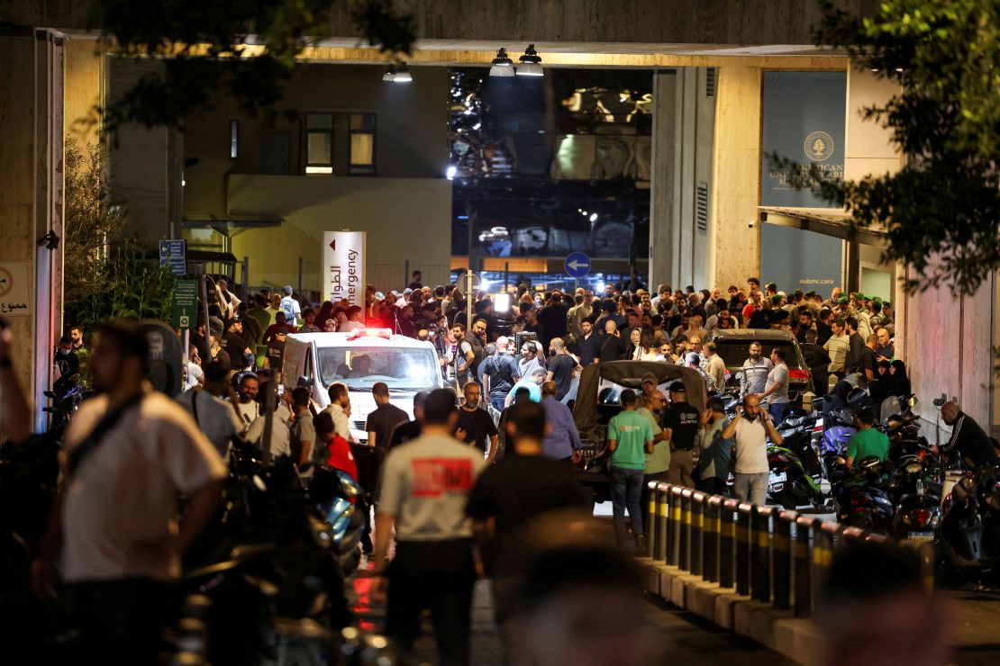 People gather outside American University of Beirut Medical Center on September 17, 2024, as people wounded in the pager attack pour in for treatment.