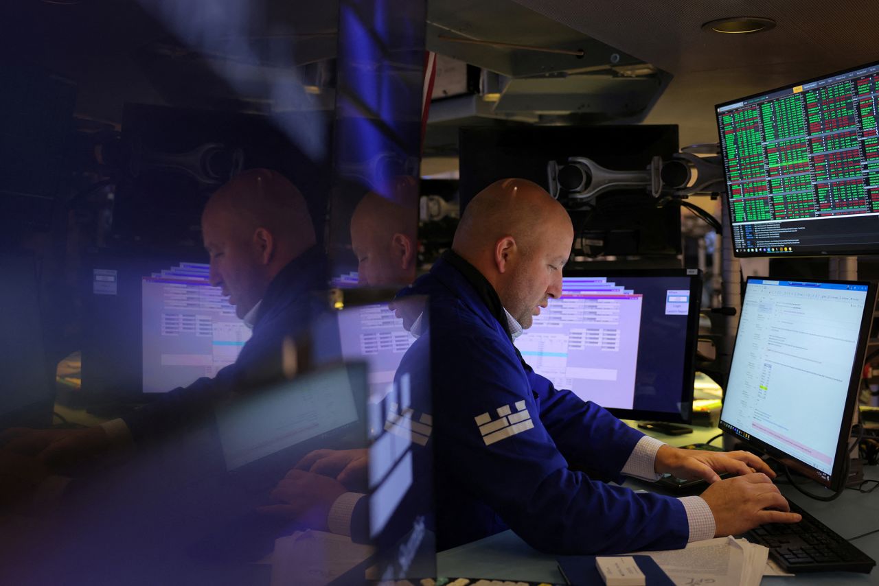 A trader works on the trading floor at The New York Stock Exchange on September 18.