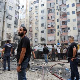 People inspect the site of an Israeli strike in the southern suburbs of Beirut, Lebanon, September 20, 2024. REUTERS/Mohamed Azakir