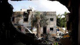 Emergency personnel work at a site of houses damaged following a rocket attack from Lebanon, amid cross-border hostilities between Hezbollah and Israel, in Kiryat Bialik, Israel, September 22, 2024.