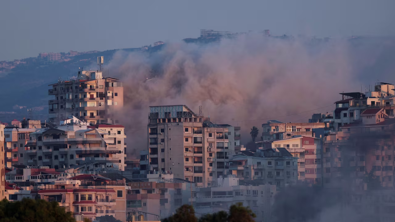 Smoke billows over southern Lebanon following an Israeli strike, as seen from Tyre, Lebanon, on Wednesday.
