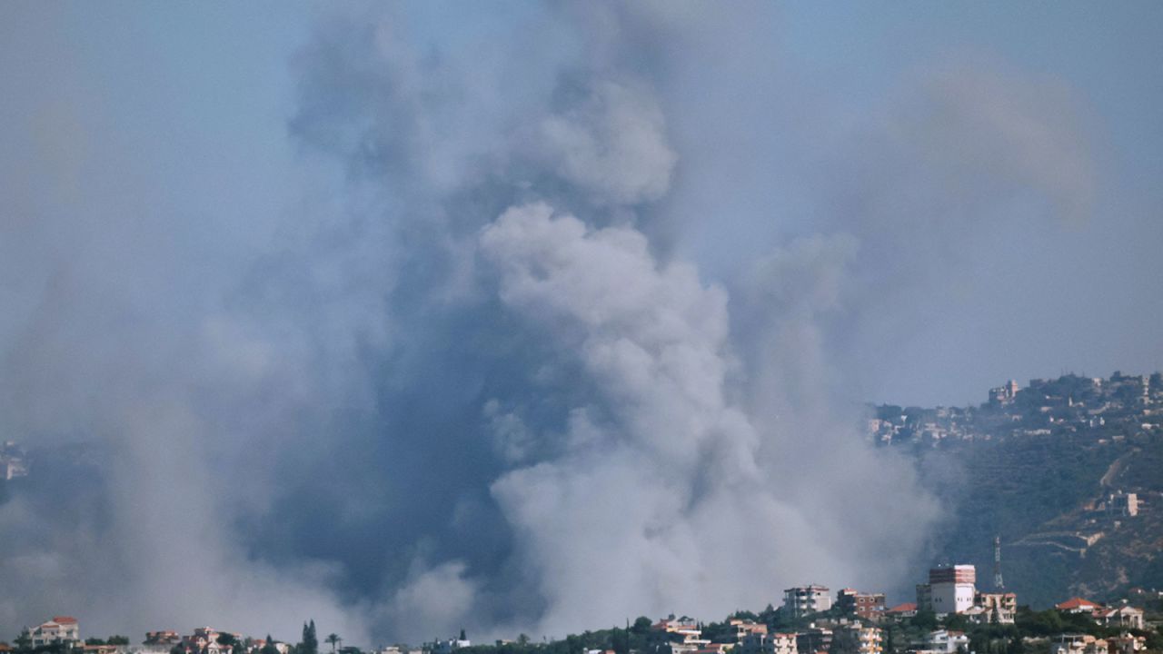 Smoke billows over southern Lebanon following an Israeli strike as seen from Tyre, Lebanon, on Thursday, September 26.