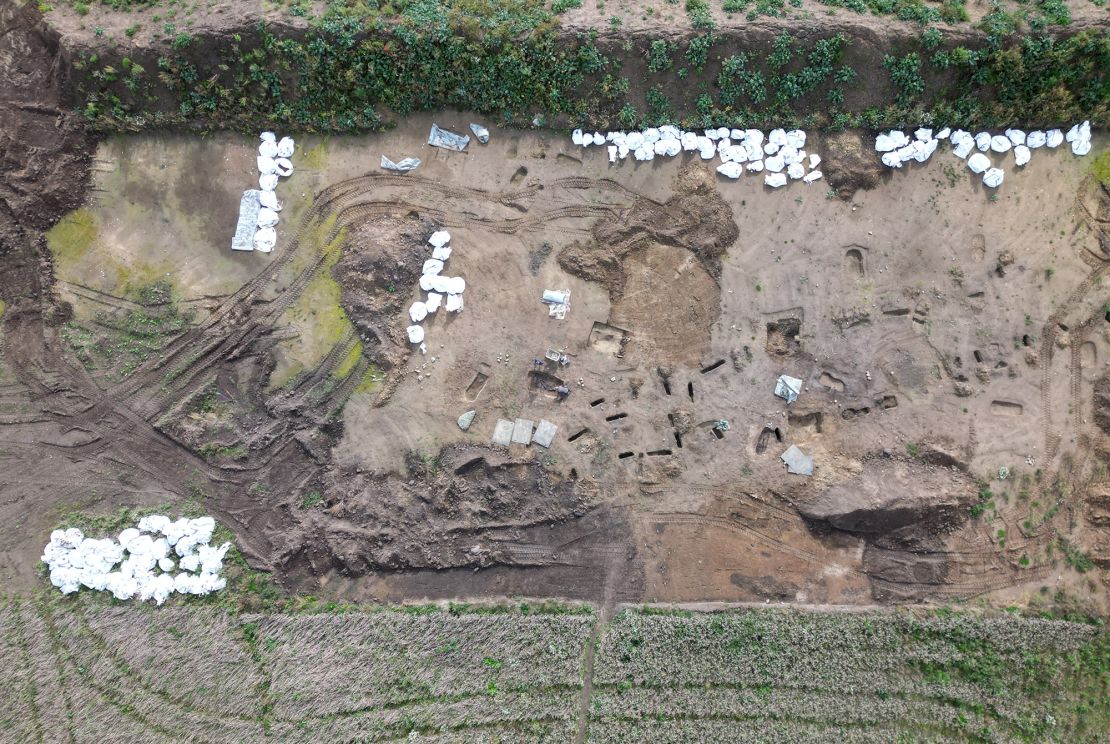 An aerial view shows archaeologists working on excavations in the Viking-age burial site found in the village of Asum, Denmark, September 25, 2024. REUTERS / Tom Little