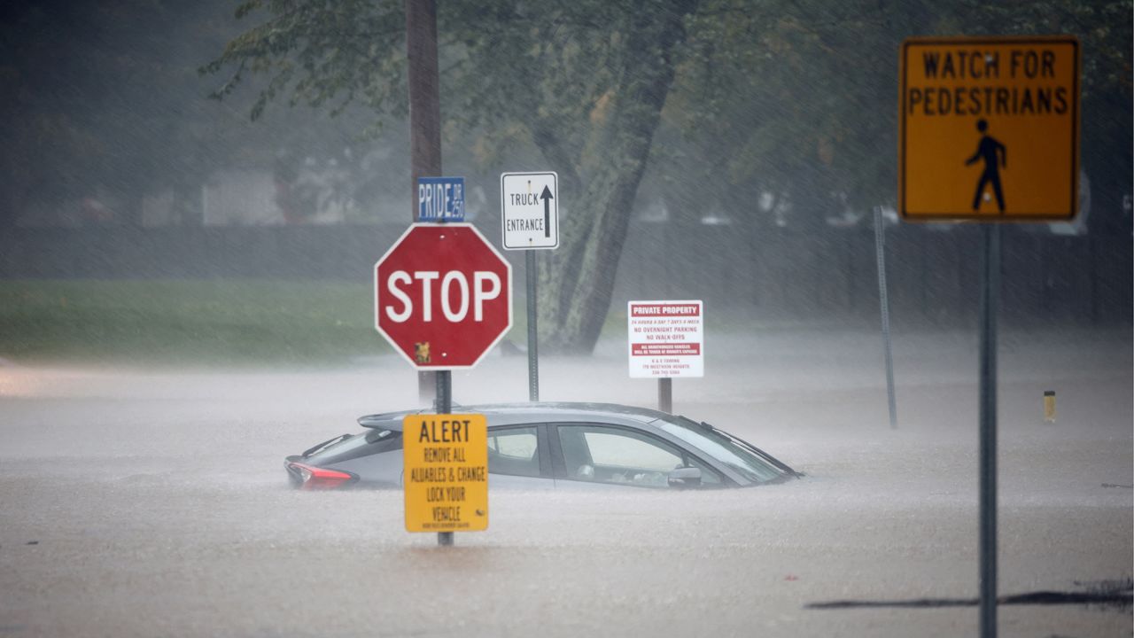 A stranded car sits in flood waters as Tropical Storm Helene strikes, in Boone, North Carolina, on Friday.