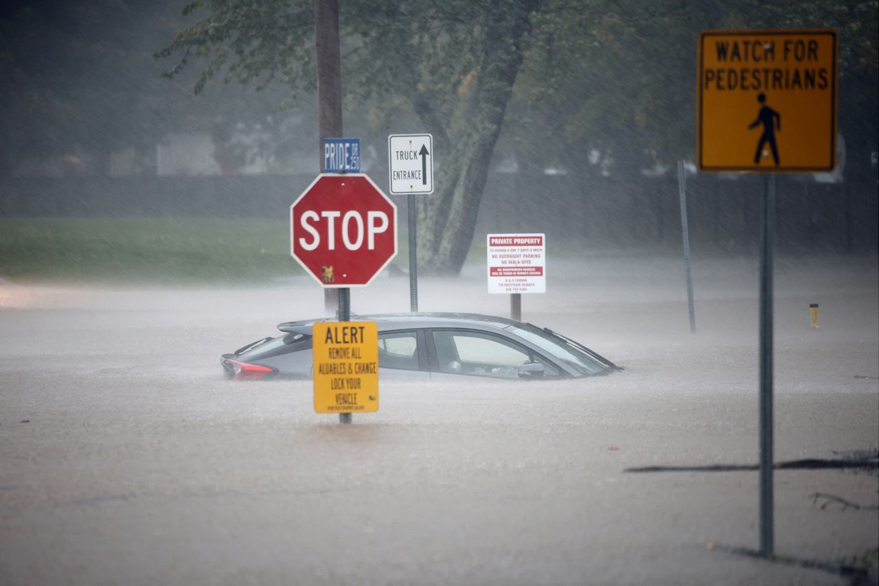 A stranded car sits in flood waters as Tropical Storm Helene strikes, in Boone, North Carolina, on Friday.