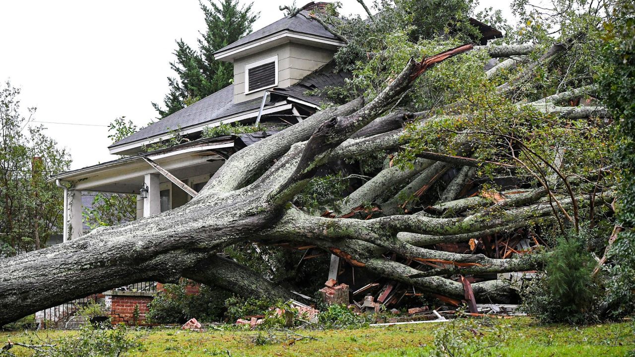 A large oak tree lies on a home in Anderson, South Carolina, on Friday.