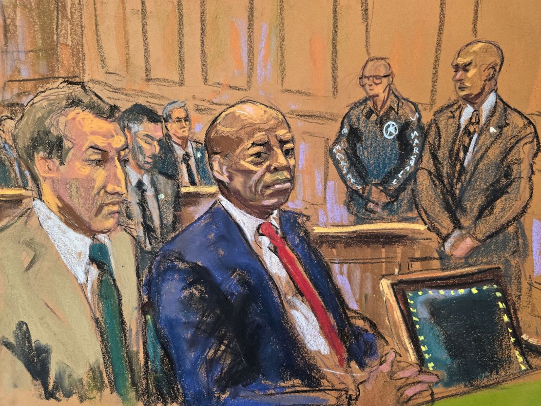 New York City Mayor Eric Adams sits in federal court beside his lawyer Alex Spiro during his arraignment in New York City on September 27, 2024.