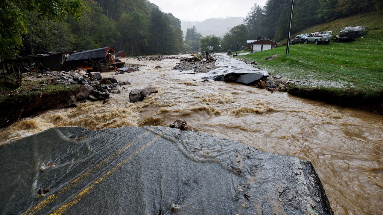 The Laurel Fork Road bridge is destroyed by floodwaters raging in the Upper Laurel Fork creek in Vilas, North Carolina, on September 27.