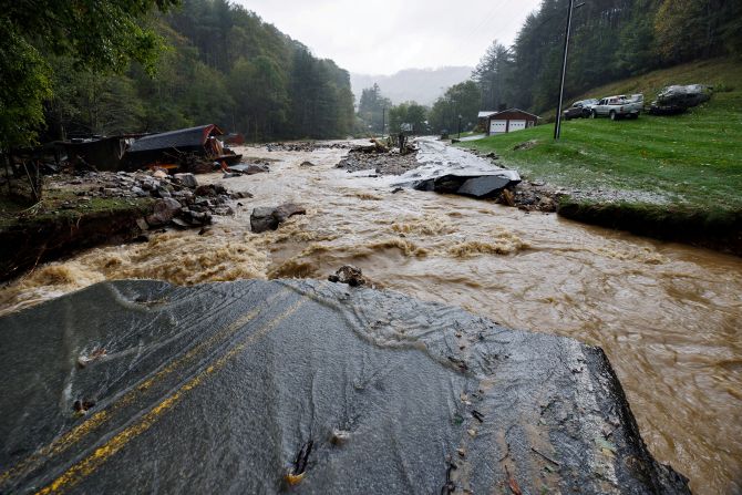 The Laurel Fork Road bridge is destroyed by floodwaters in Vilas, North Carolina, on September 27.