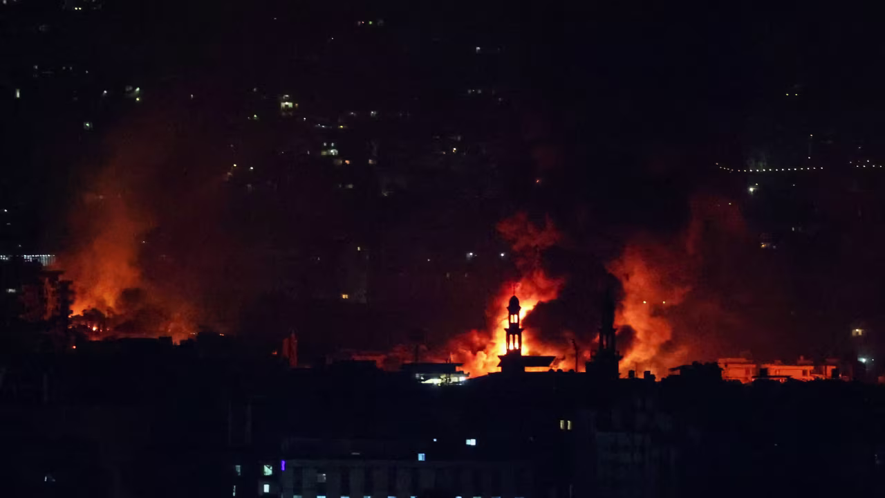 Smoke billows over Beirut's southern suburbs as seen from Sin El Fil, Lebanon, on Saturday, September 28.