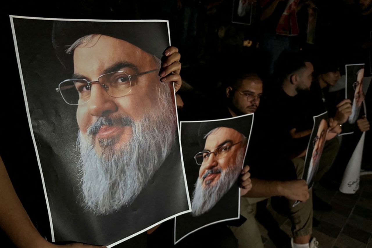 Supporters of Lebanon's Hezbollah leader Sayyed Hassan Nasrallah carry his pictures as they gather in Sidon, Lebanon, following his killing in an Israeli airstrike in Beirut's southern suburbs on September 28, 2024.