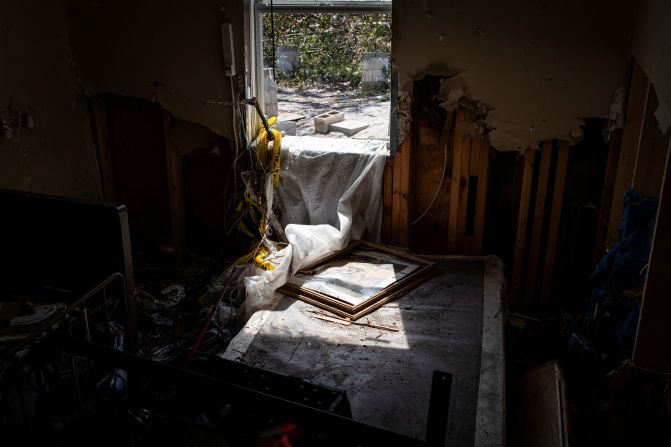 Light filters into a room of a home destroyed by the hurricane in Horseshoe Beach, Florida, on Saturday.