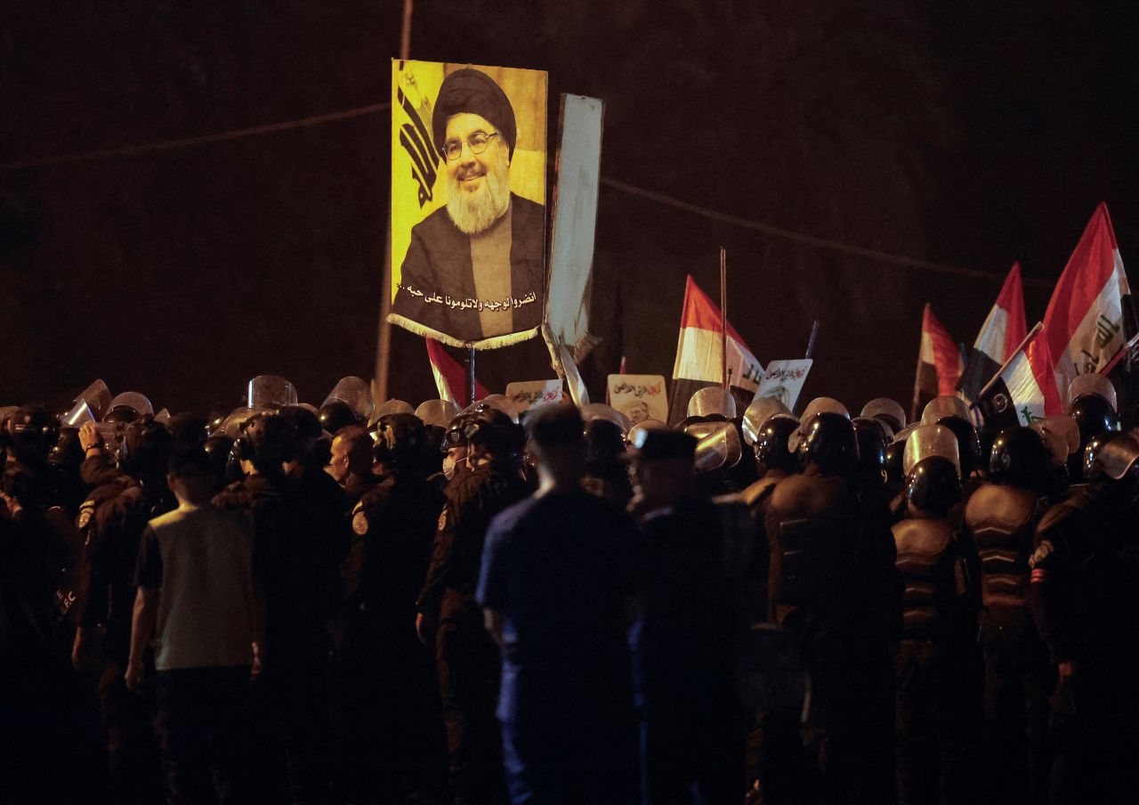 People protest in Baghdad, Iraq, following the announcement that Hezbollah leader Hassan Nasrallah was killed by Israel, on September 28.