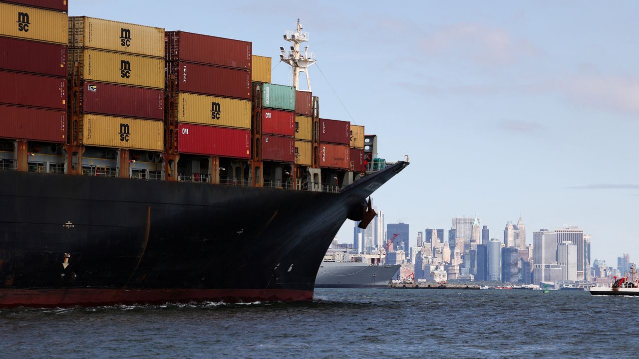 A ship carries shipping containers through Upper Bay in New York on September 30.