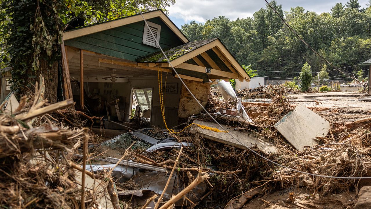 A destroyed house with a car under it in Chimney Rock, North Carolina, on September 29.