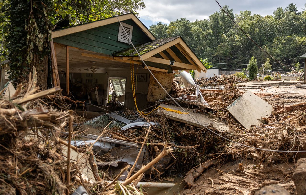 A destroyed house with a car under it in Chimney Rock, North Carolina, on September 29.