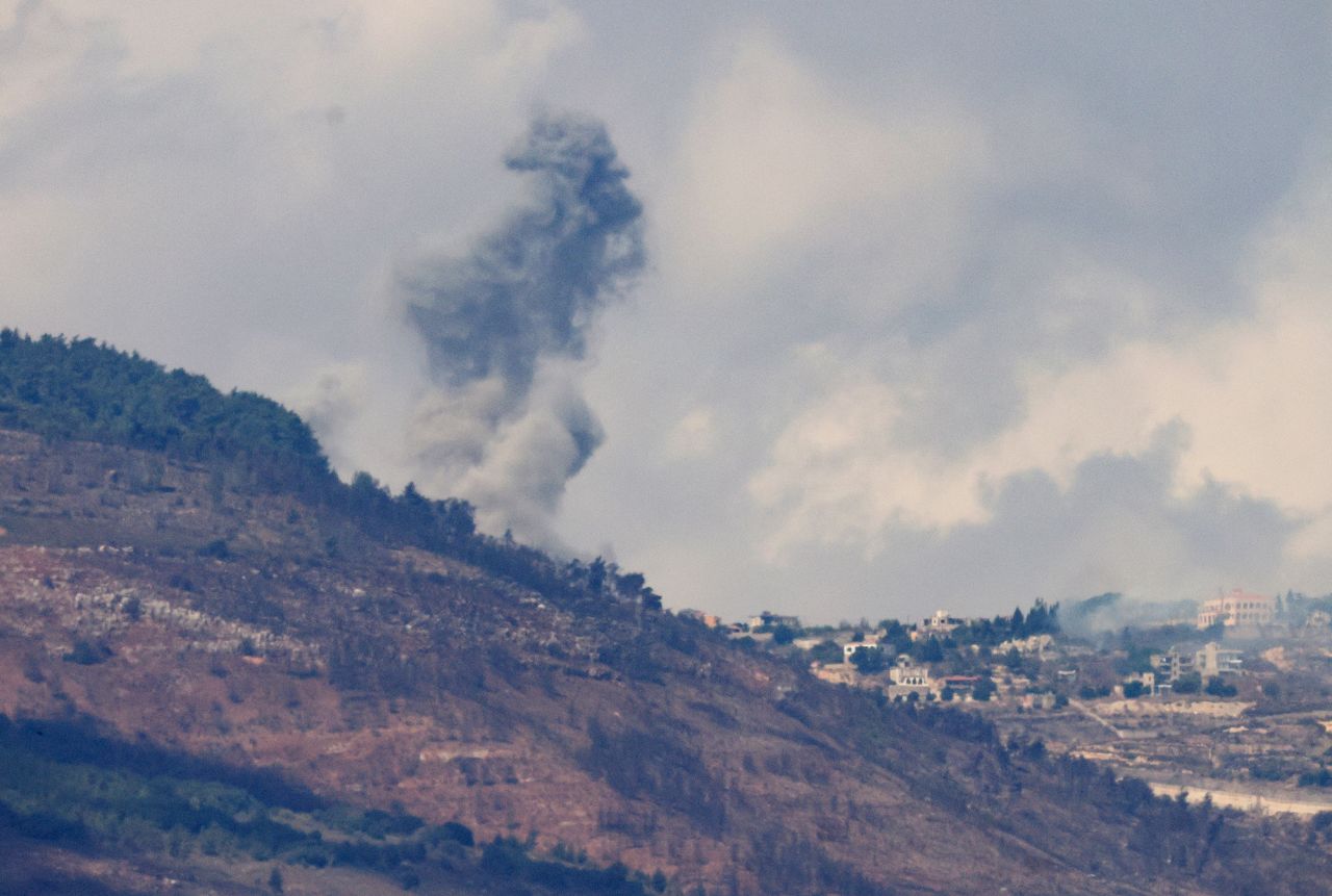 Smoke billows near a village in southern Lebanon after an Israeli air strike, as seen from northern Israel, on October 1.