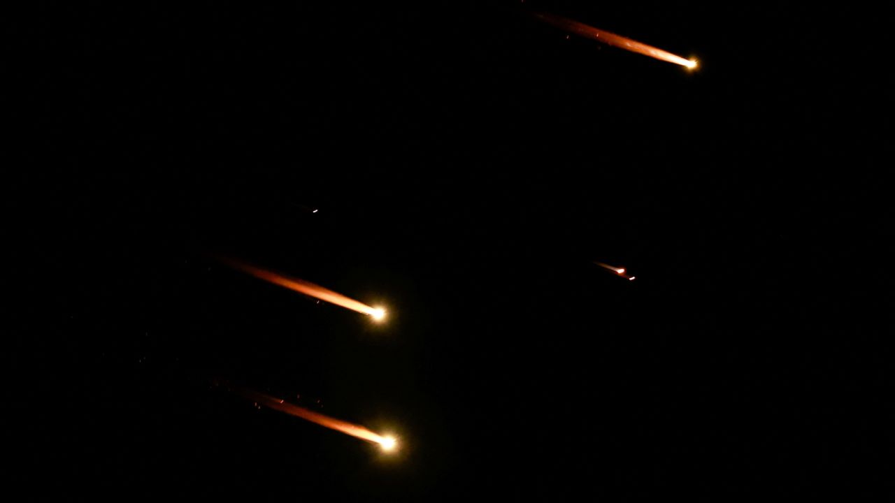 Rockets fly in the sky, amid cross-border hostilities between Hezbollah and Israel, as seen from Tel Aviv, Israel, on October 1.