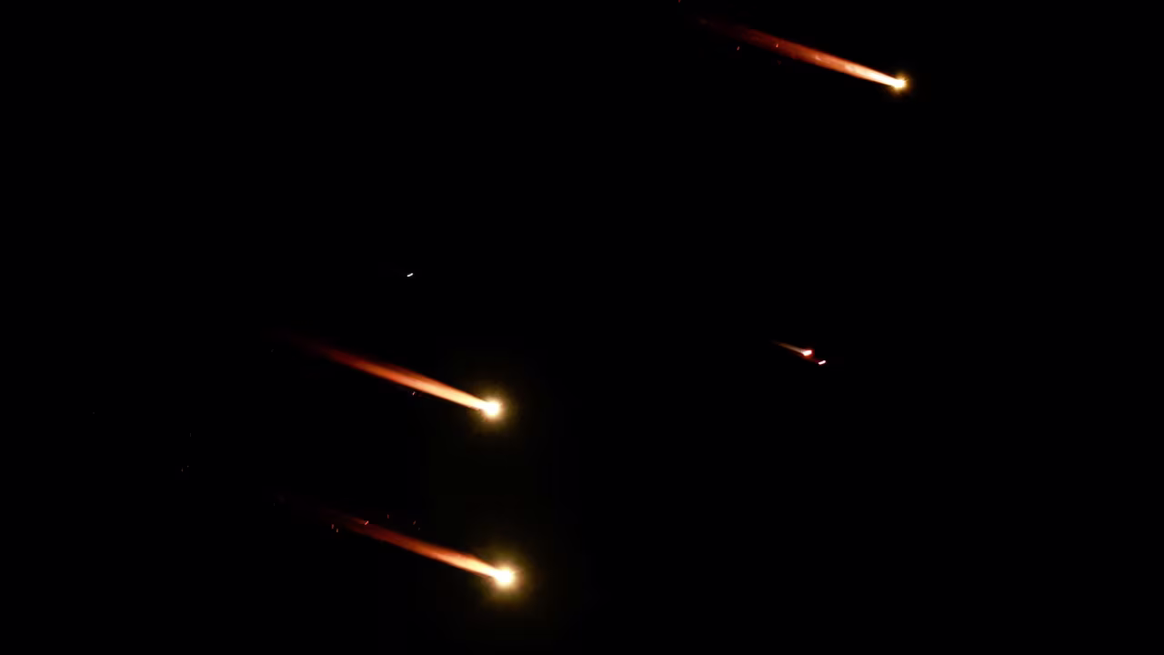 Rockets are seen in the sky from Tel Aviv on Tuesday.