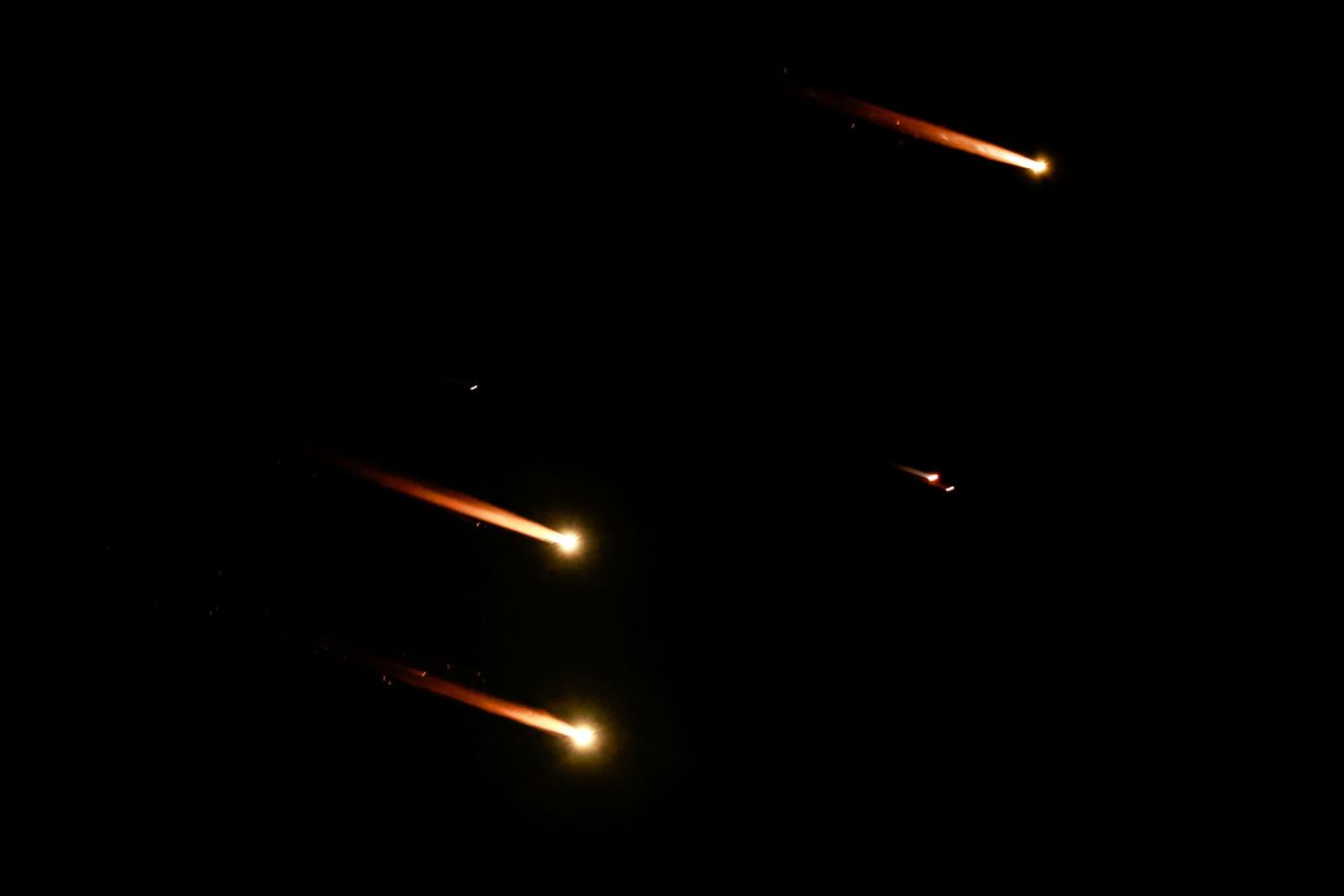 Rockets are seen in the sky from Tel Aviv on Tuesday.