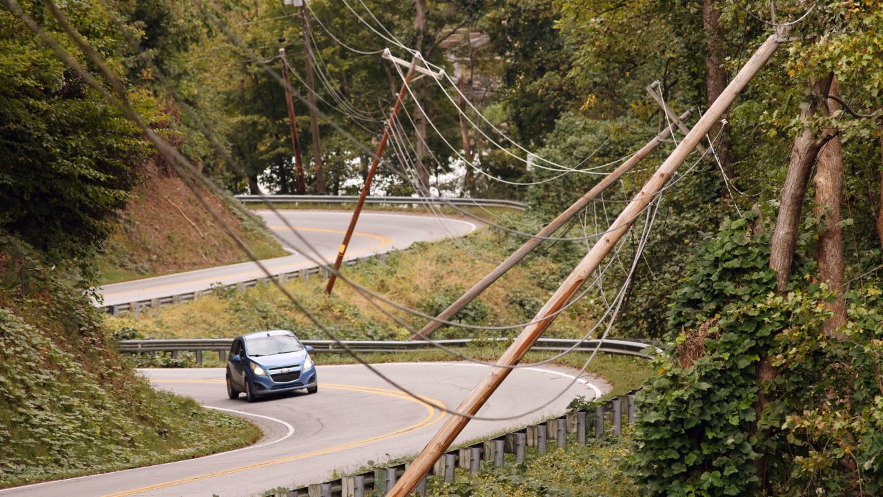 Power line poles lean after Hurricane Helene caused widespread damage to infrastructure in Lake Lure, North Carolina, on Tuesday.